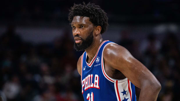 Joel Embiid looks on during a game.